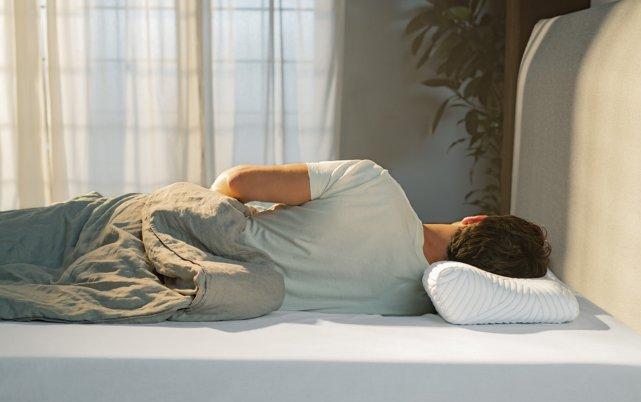 Woman laying on TEMPUR Pillow