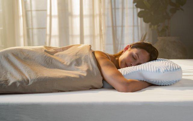 Woman laying on TEMPUR Pillow