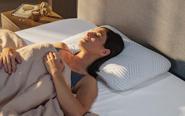 Woman laying on TEMPUR Pillow