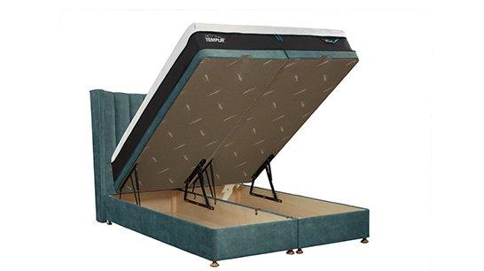 A Tempur Suffolk bed with the mattress lifted showing the storage underneath