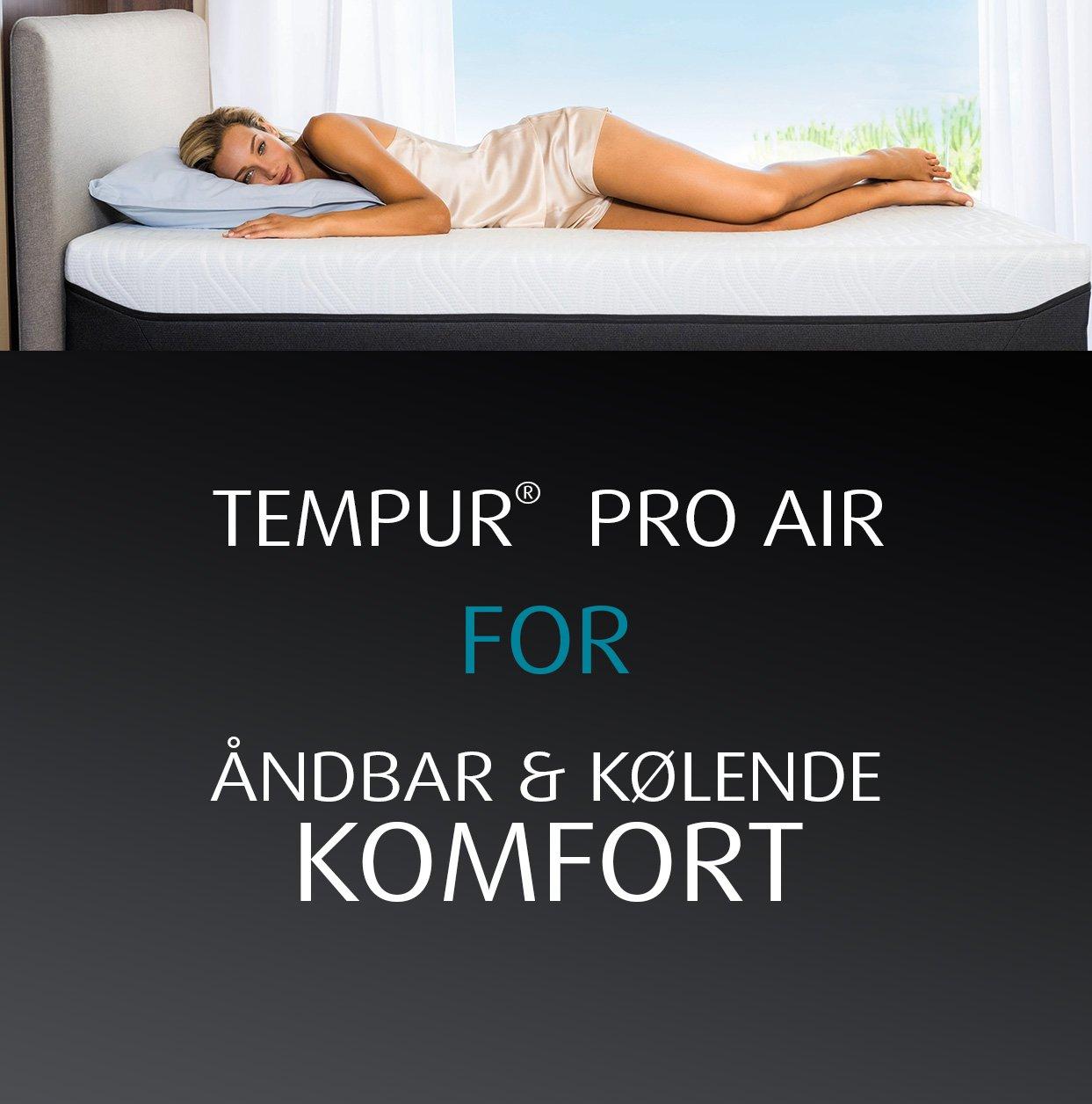 Lady lying on TEMPUR mattress and pillow